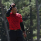 Tiger Woods tips his hat to the crowd on the 18th green after finishing his round during the final round of the Masters at Augusta National Golf Club on April 10, 2022 in Augusta, Georgia.